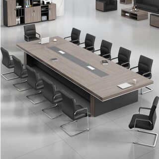 A large, elegant 14-16 seater boardroom table made of polished hardwood, featuring rounded edges and built-in cable management, set in a modern office space.