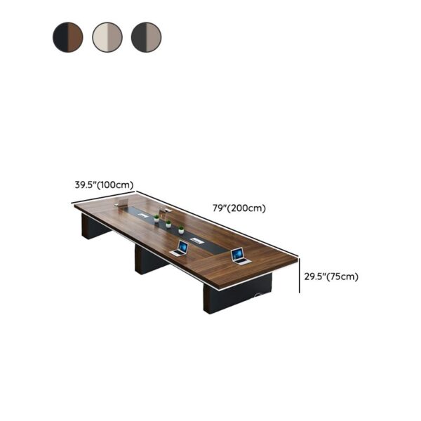 A large, elegant 14-16 seater boardroom table made of polished hardwood, featuring rounded edges and built-in cable management, set in a modern office space.