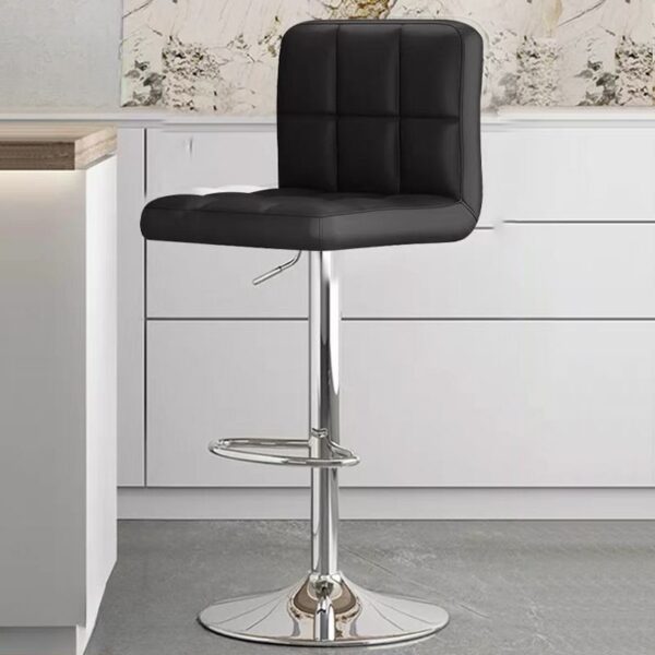 Height-adjustable barstool with chrome base and faux leather seat, showcasing modern design and comfort.