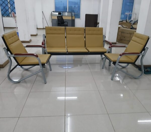 Elegant 5-seater brown reception sofa with plush cushions and wooden legs in a modern office setting.