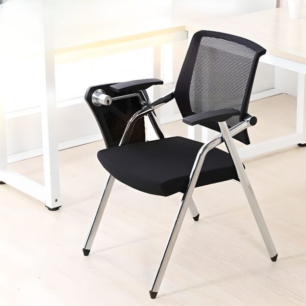 A black foldable study office chair with a cushioned seat and backrest, positioned in a modern home office setting.