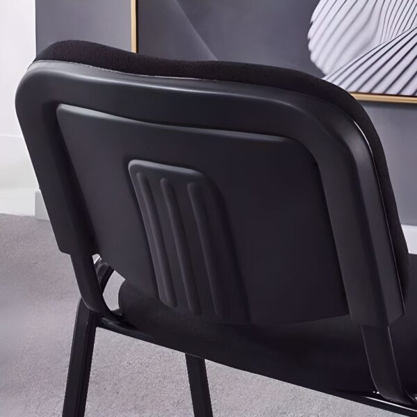 Black Tosca Visitors Office Chair with ergonomic design and padded seat, set against a modern office backdrop.