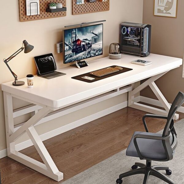 A modern industrial writing desk featuring a reclaimed wood tabletop with a natural finish, complemented by geometric metal legs.