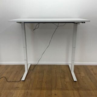 1.4 Meters Height Adjustable Standing Desk with a modern design, featuring an electric lift system and spacious tabletop in a stylish office setting.