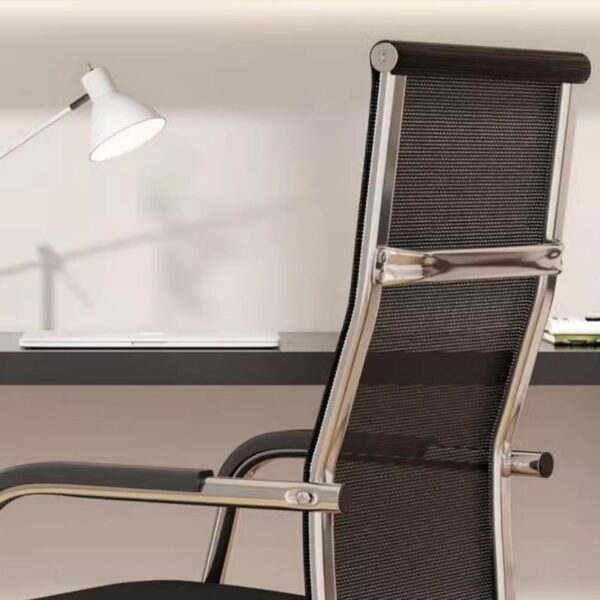 Upholstered high back office chair with modern design and ergonomic support in a stylish workspace.