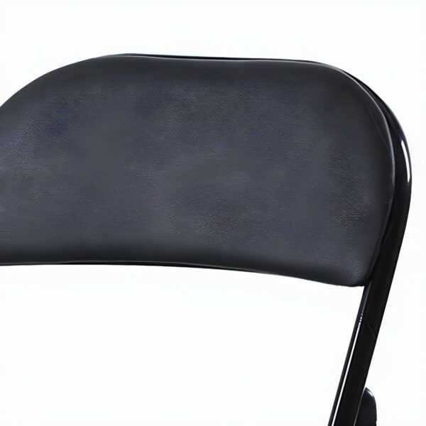 Armless Black Foldable Leather Chair in a modern living room setting.