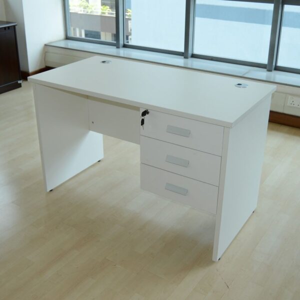 White wooden home office desk with a minimalist design, featuring a spacious surface for work essentials.