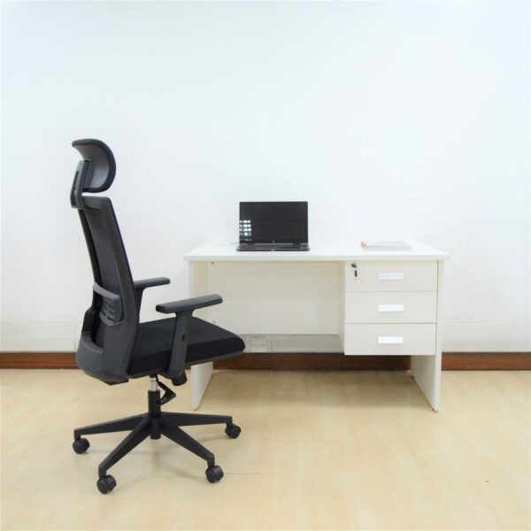 White wooden home office desk with a minimalist design, featuring a spacious surface for work essentials.