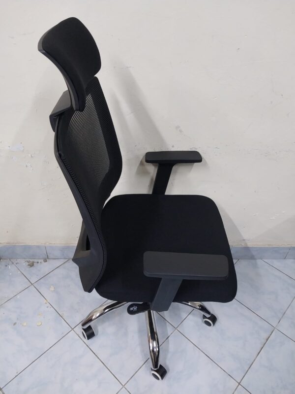 Black Orthopedic Office Seat with ergonomic design and breathable mesh back.