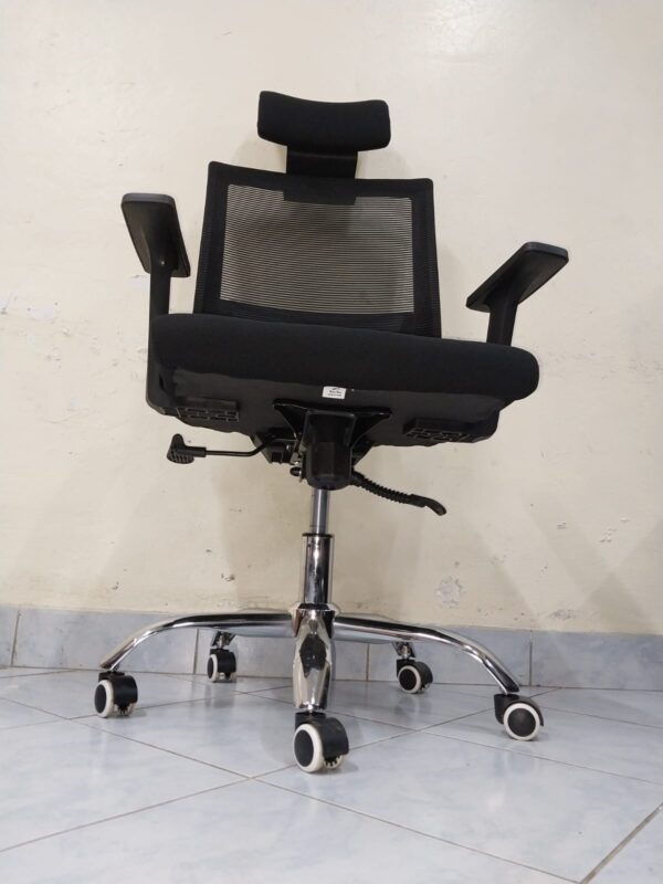 Black Orthopedic Office Seat with ergonomic design and breathable mesh back.