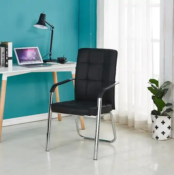 Black Leather Office Visitor Seat in a modern office setting, showcasing its elegant design and plush cushioning.