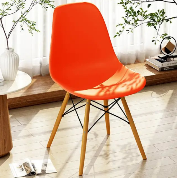 Eames Plastic Dining Seat with a sleek plastic shell and wooden legs, showcasing mid-century modern design.