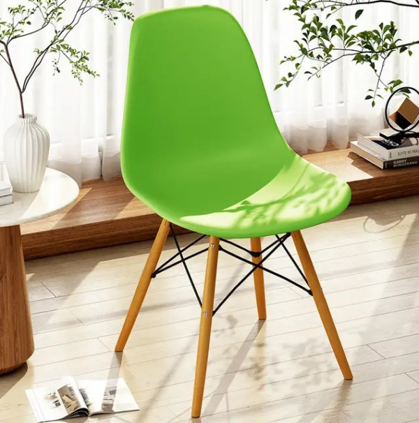 Eames Plastic Dining Seat with a sleek plastic shell and wooden legs, showcasing mid-century modern design.