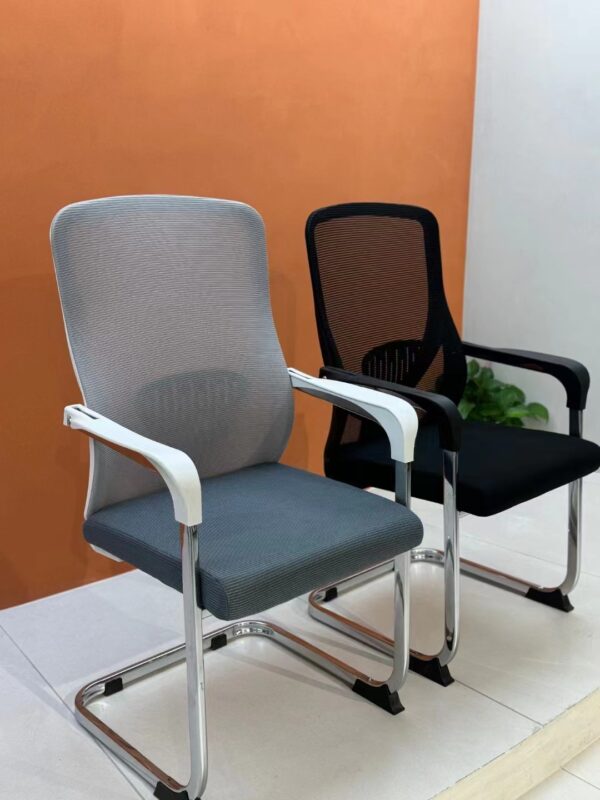 Ergonomic Mesh Back Arm Chair with breathable mesh backrest and adjustable height in a modern office setting.