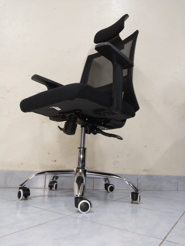 Black Orthopedic Office Seat with ergonomic design and breathable mesh back.