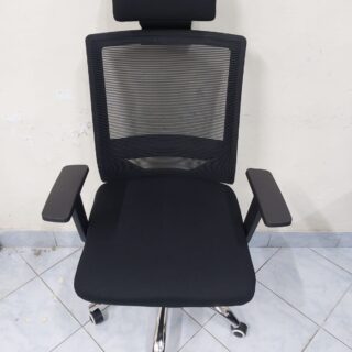 Black Orthopedic Office Seat with ergonomic design and breathable mesh back.