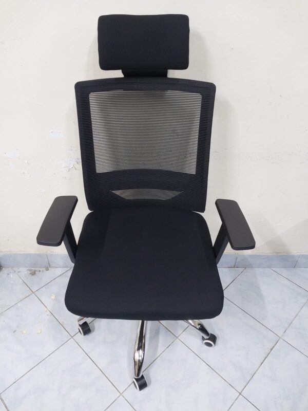 Black Orthopedic Office Seat with ergonomic design and breathable mesh back.