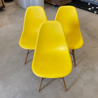 Eames Plastic Dining Seat with a sleek plastic shell and wooden legs, showcasing mid-century modern design.