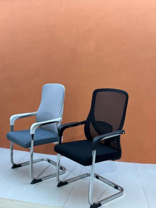 Ergonomic Mesh Back Arm Chair with breathable mesh backrest and adjustable height in a modern office setting.