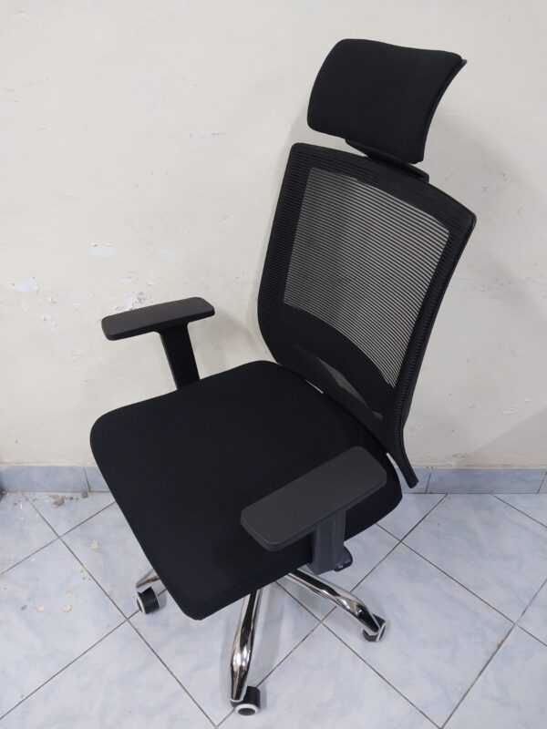 Black Orthopedic Office Seat with ergonomic design and breathable mesh back.