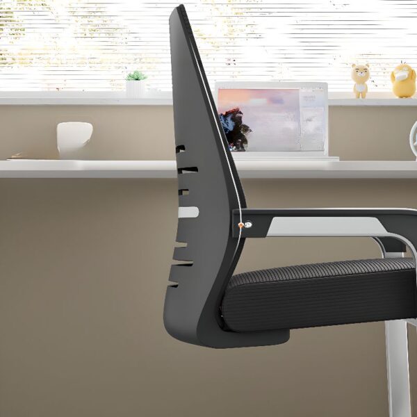 Black Office Mid-Back Guest Seat in a modern office setting, showcasing its sleek design and comfortable padding.