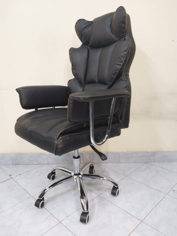 Black Directors Executive Office Chair with leather upholstery and chrome base in a modern office setting.