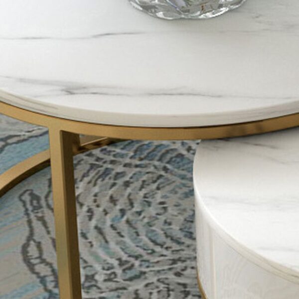 White Round Marble Table with polished surface and sturdy base in a modern living room setting.