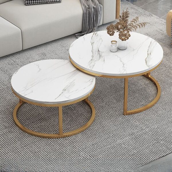 White Round Marble Table with polished surface and sturdy base in a modern living room setting.