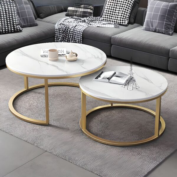 White Round Marble Table with polished surface and sturdy base in a modern living room setting.