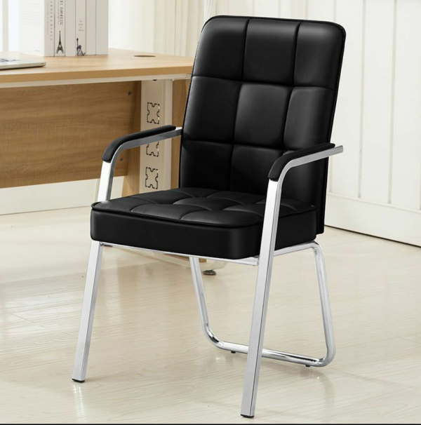 Black Leather Office Visitor Seat in a modern office setting, showcasing its elegant design and plush cushioning.