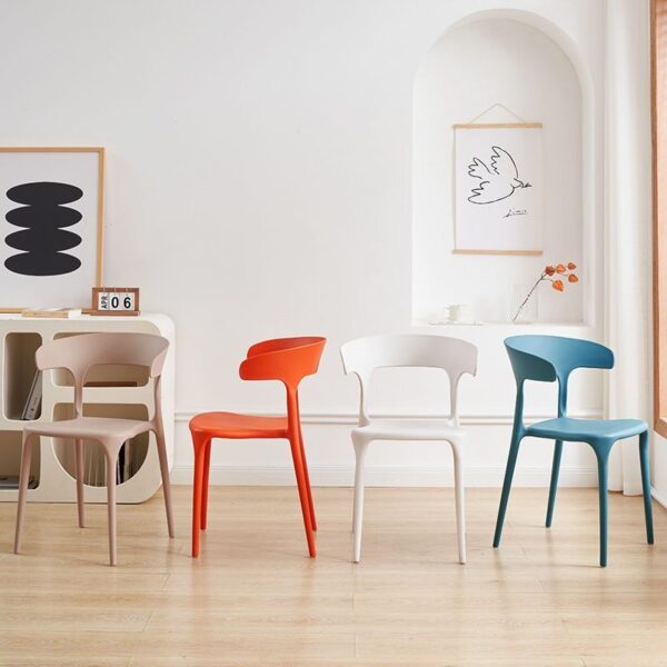 Bseak Plastic Dining Chair in a modern dining room setting, showcasing its sleek design and vibrant color options.