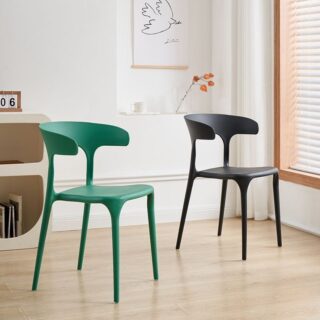 Bseak Plastic Dining Chair in a modern dining room setting, showcasing its sleek design and vibrant color options.