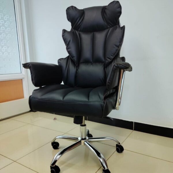 Black Directors Executive Office Chair with leather upholstery and chrome base in a modern office setting.