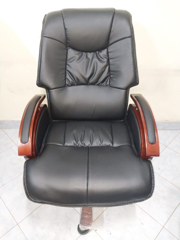 Directors Executive Leather Office Seat showcasing premium leather, ergonomic design, and stylish armrests in a modern office environment.