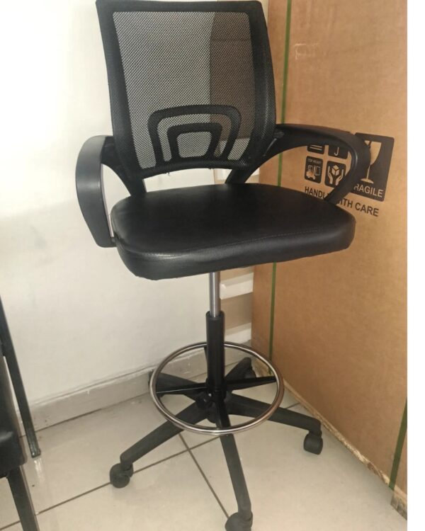 Mid-Back Swivel Office Task Chair with breathable mesh back and padded seat in a modern workspace.