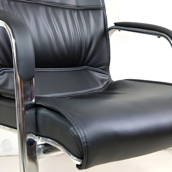 Black Office Executive Visitor Chair with chrome accents and ergonomic design, suitable for executive offices and conference rooms.