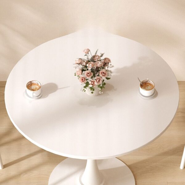 Simple Modern Round Dining Table with sleek finish and minimalist design, perfect for contemporary dining spaces.