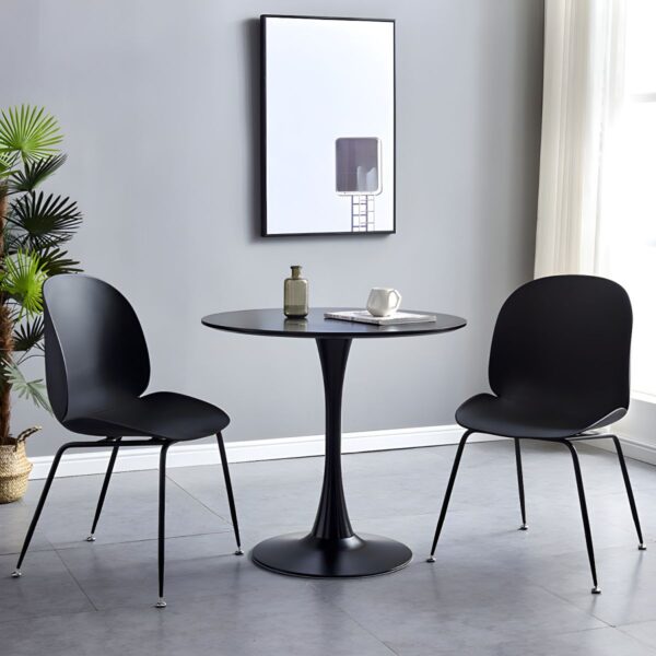 Modern Round Eames Dining Table with wood veneer top and molded fiberglass base, set in a contemporary dining room.