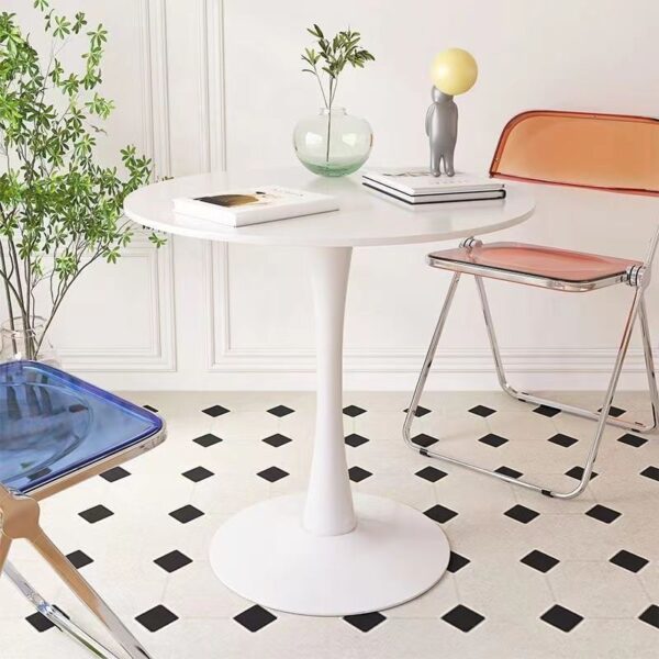 Modern White Round Dining Table with a sleek design and sturdy base in a contemporary dining room setting.