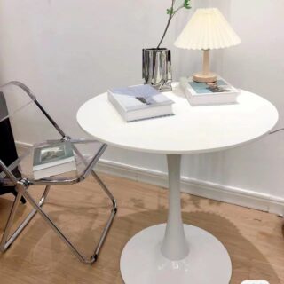 Modern White Round Dining Table with a sleek design and sturdy base in a contemporary dining room setting.