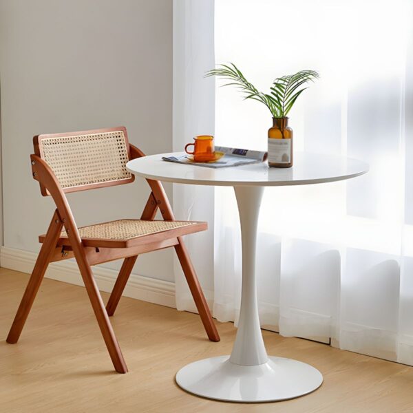 Simple Round Solid Wood Dining Table with natural wood grain, sturdy base, and minimalist design.