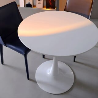 Modern Manufactured Round Wooden Dining Table with sleek wood finish and minimalistic design, set in a contemporary dining room.