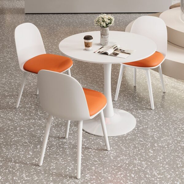 Round White Engineered Wood Dining Table with a smooth, sleek finish, ideal for modern dining rooms or kitchens.