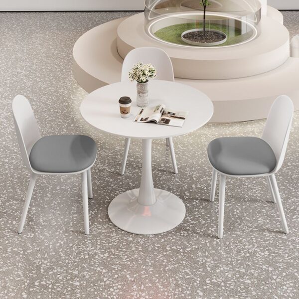 Round White Engineered Wood Dining Table with a smooth, sleek finish, ideal for modern dining rooms or kitchens.