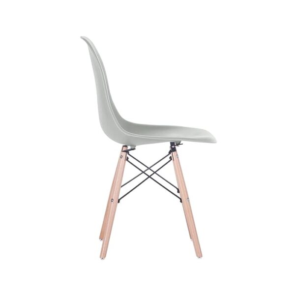 Eames Modern Plastic Dining Chair with molded plastic seat and wooden legs, set in a stylish dining room setting.