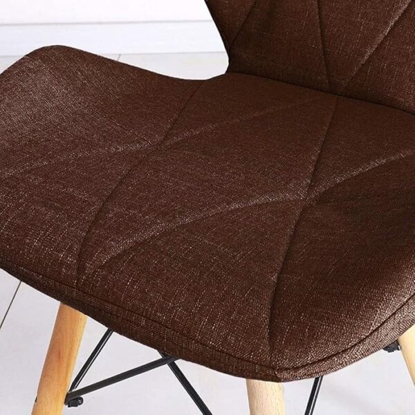 Stylish Eames Fabric Dining Chair with soft fabric upholstery and wooden legs, inspired by mid-century design.