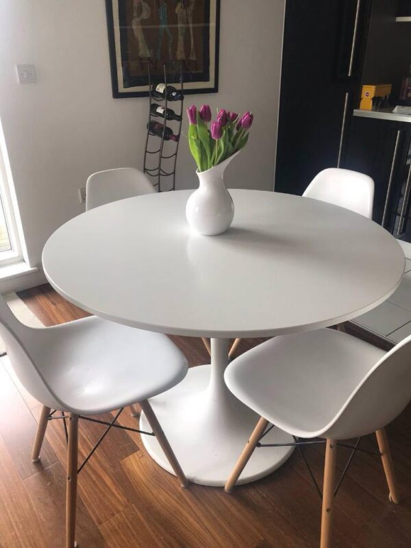 Whether you're hosting guests or enjoying a quiet meal with family, the 4-Seater Tulip Round Dining Table elevates your dining experience with its charm and sophistication.