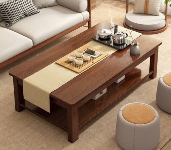 Modern Executive Office Coffee Table with a minimalist design, featuring a glass top and metal legs, set in a corporate office environment.