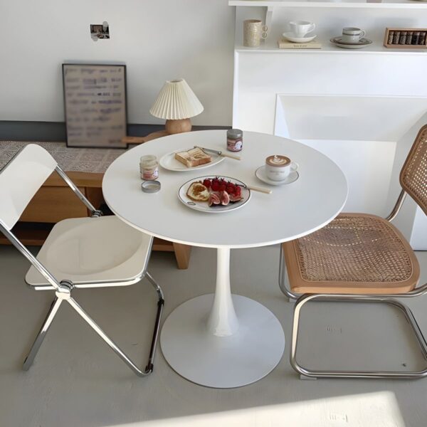 Simple Round Solid Wood Dining Table with natural wood grain, sturdy base, and minimalist design.