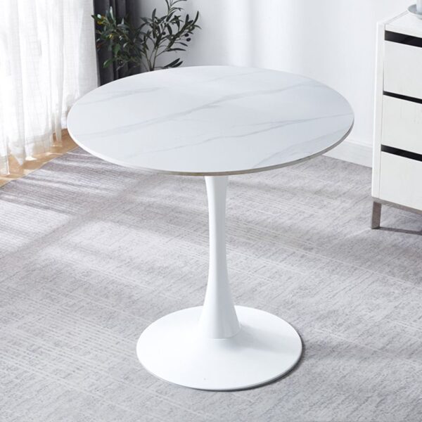 Modern White Round Dining Table with a sleek design and sturdy base in a contemporary dining room setting.